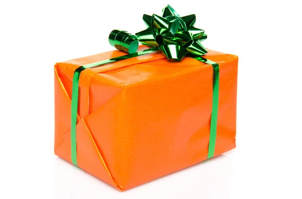 Orange gift box with a green bow — Stock Photo, Image