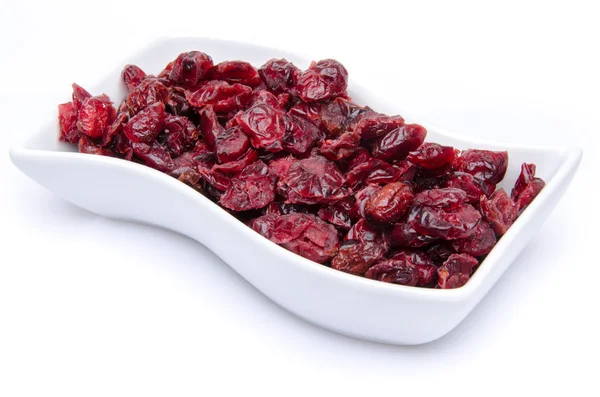 Dried cranberries in a cup — Stock Photo, Image