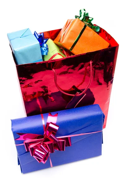Colorful gift boxes in a bag — Stock Photo, Image