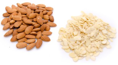 Heaps of whole and flaked almonds clipart