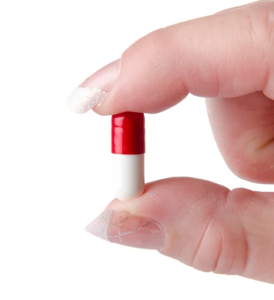 Hand holding a capsule — Stock Photo, Image
