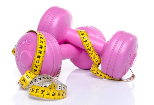 Pink dumbells with a tape measure — Stock Photo, Image