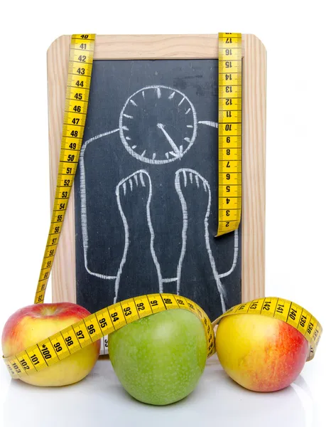 Conceito de perda de peso, maçãs e uma fita métrica — Fotografia de Stock