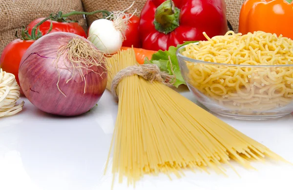 Uncooked pasta with vegetables — Stock Photo, Image