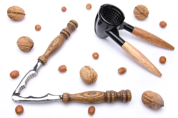 Composition with walnuts, hazelnuts and a nutcracker — Stock Photo, Image