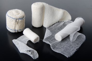 Different rolls of medical bandages clipart