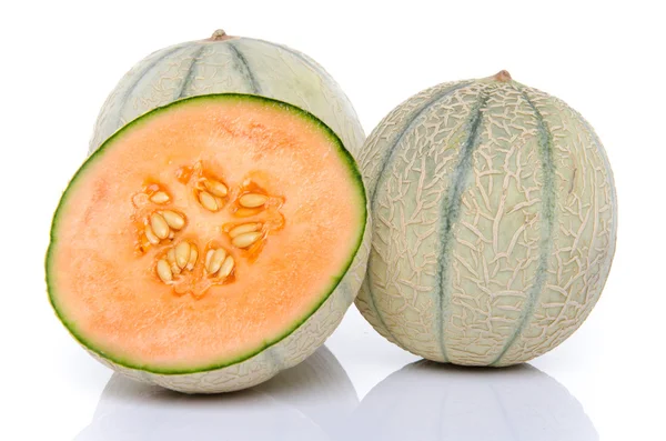 Two whole melon and one half — Stock Photo, Image