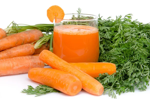 Composition with a glass of carrot juice and fresh carrots — Stock Photo, Image