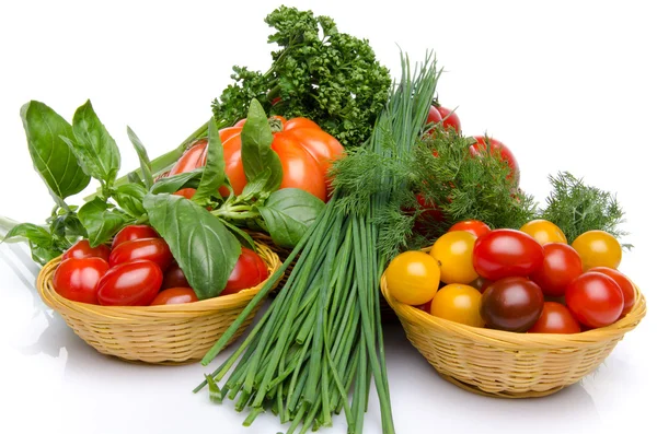 Composition of different varieties of tomatoes with herbs — Stock Photo, Image