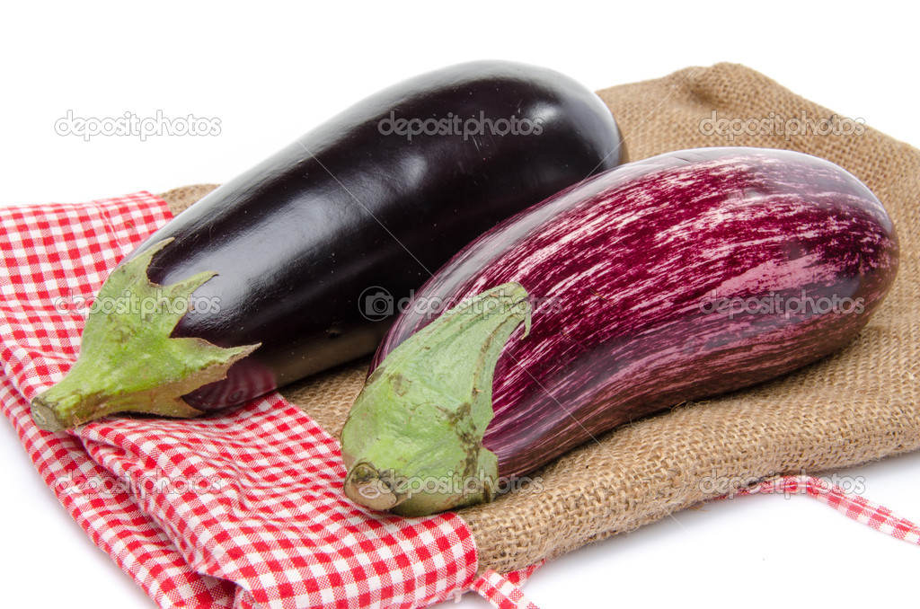 Purple and black eggplant on a burlap bag