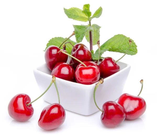 Composition with a cup of cherries and mint — Stock Photo, Image