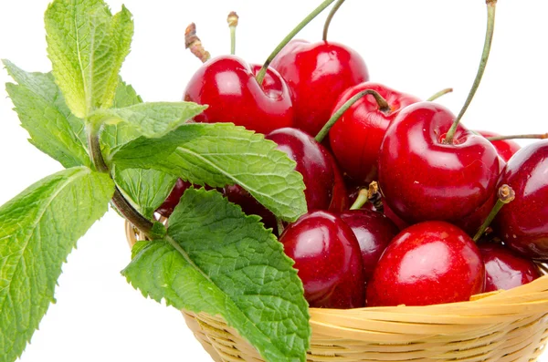 Composition with cherries and mint in a basket — Stock Photo, Image