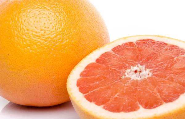 Grapefruity a polovina grapefruitu — Stock fotografie