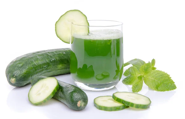 Composition with a glass of cucumber juice and fresh cucumbers — Stock Photo, Image