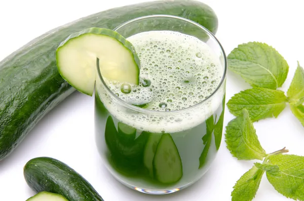 Composition with a glass of cucumber juice, fresh cucumbers and — Stock Photo, Image