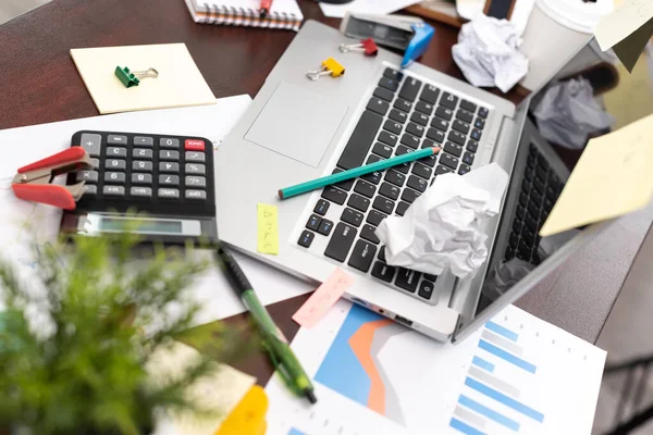 Messy and cluttered office desk