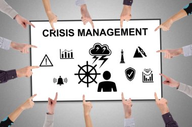 Kriz yönetimi kavramına işaret eden eller