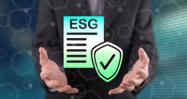Esg kavramı, arka plandaki bir adamın ellerinden üstündür.