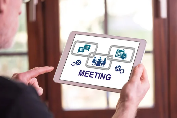Man Holding Tablet Showing Meeting Concept — стоковое фото