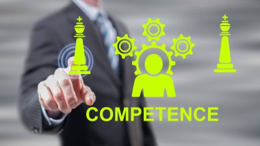 Dokunmatik ekranda beceriklilik kavramına parmaklarıyla dokunan bir adam.