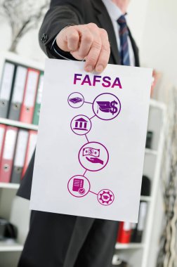 Bir işadamının sahip olduğu Fafsa konseptini gösteren kağıt.