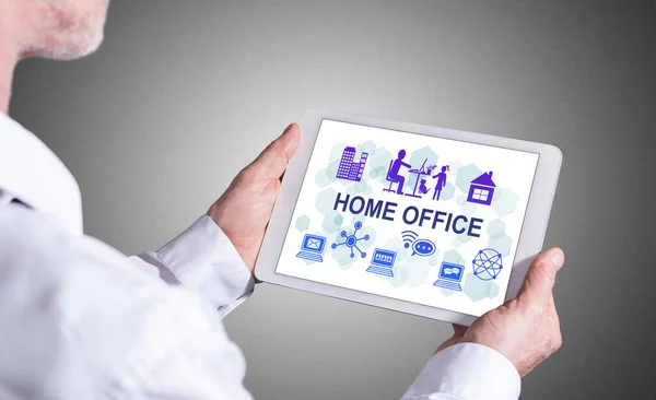 Man Holding Tablet Showing Home Office Concept — Stock fotografie