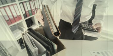 Businessman fired, putting his personal effects in a box, geometric pattern