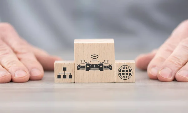 Wooden blocks with symbol of connected cars concept