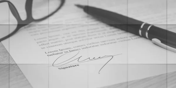 Closeup of signed legal document, geometric pattern