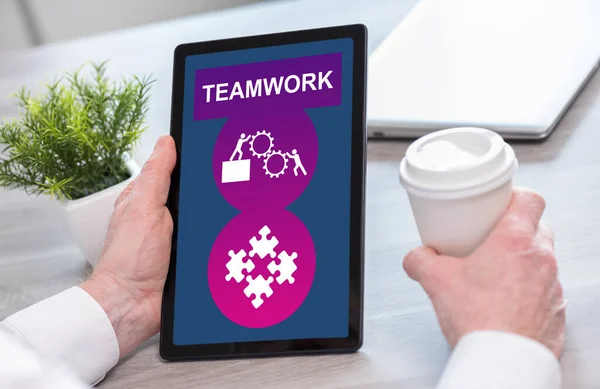 Tablet screen displaying a teamwork concept