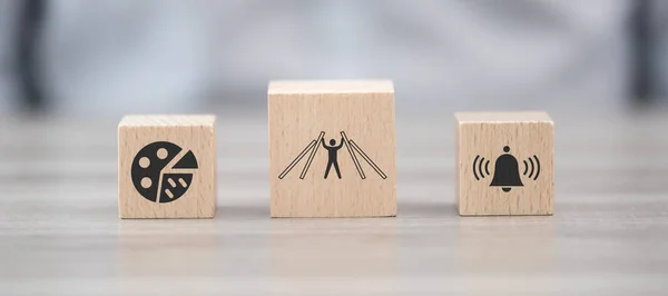 Wooden blocks with symbol of crisis management concept