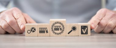 Wooden blocks with symbol of document management concept