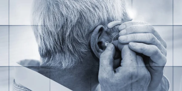 Senior Man Putting Hearing Aids Geometric Pattern — ストック写真