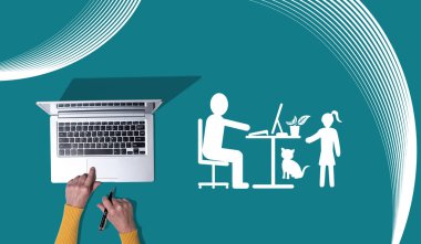 Top view of hands using laptop with symbol of home office concept