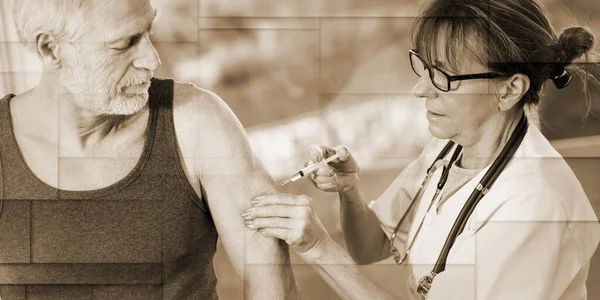 Female Doctor Injecting Vaccine Senior Man Geometric Pattern — Φωτογραφία Αρχείου