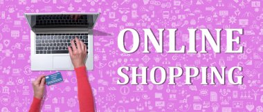 Online shopping concept with top view of hands using laptop on icons background