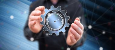 Arka plandaki bir adamın elleri arasındaki zaman yönetimi kavramı