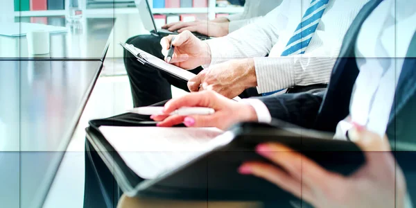 Business people taking notes during a training, geometric pattern