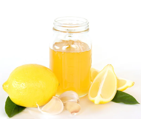 Remedio para el resfriado y la gripe - Miel de limón y ajo Imagen de stock