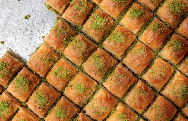 Baklava is a traditional Turkish dessert. It is made with pistachio and walnut. Thin dough and sugar sherbet are used in making baklava.
