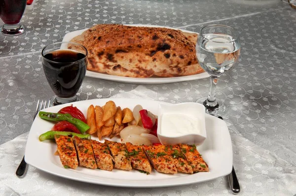 Beyti kebab is a traditional Turkish dish. Beyti Kebab; It is made with meat, eggs, garlic, onions, spices and phyllo dough.