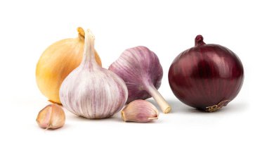 A mix of fresh garlic and onions on a white background.Close-up.