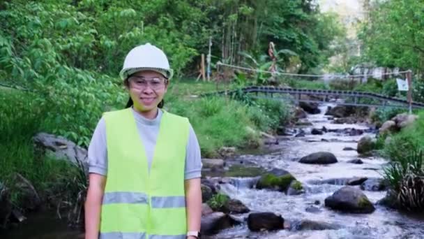 Environmental Engineer Helmet Stands His Arms Crossed Smiles Camera Background — Stock Video
