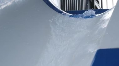 Water slides with splashing water in the water park