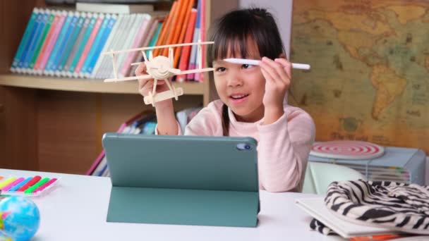 Cute Little Girl Holding Stylus Pen Working Tablet Holding Wooden — Stockvideo