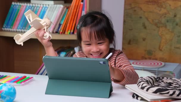 Cute Little Girl Holding Stylus Pen Working Tablet Holding Wooden — Stockvideo