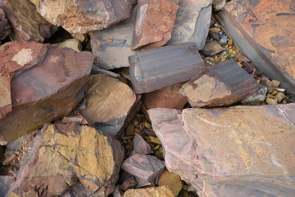 River stones background. Close-up of a natural river bank stone in a mountain forest in central Thailand. Stone and ecology concept.