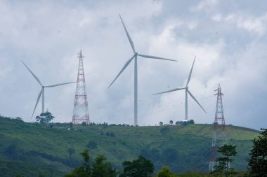 Windmill for electric power production with beautiful landscapes and blue skies to generate clean renewable green energy for sustainable development.