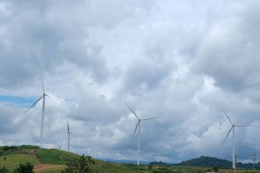 Windmill for electric power production with beautiful landscapes and blue skies to generate clean renewable green energy for sustainable development.