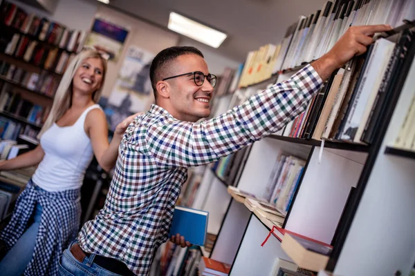 Handsome Young Couple Looking Books Library Book Learning Lifestyle Concept — Foto de Stock